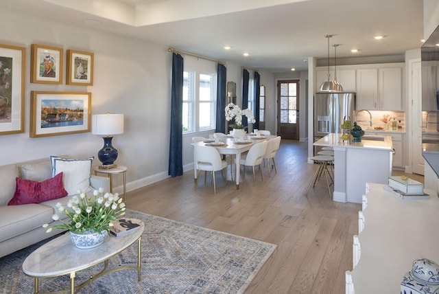 410 Holly Rd, Oak Point, TX 75068 - living room featuring light wood-type flooring, recessed lighting, and baseboards