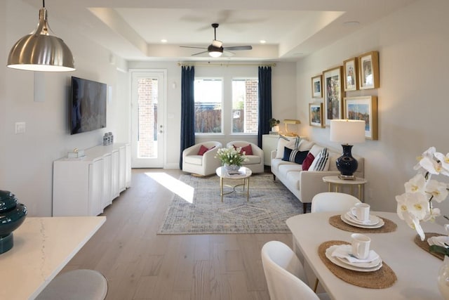 410 Holly Rd, Oak Point, TX 75068 - living room featuring a tray ceiling, wood finished floors, and ceiling fan