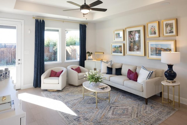 410 Holly Rd, Oak Point, TX 75068 - living area with a ceiling fan, baseboards, a raised ceiling, and wood finished floors