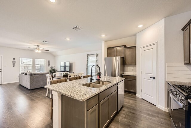 706 Spur Rdg, Princeton, TX 75407 - kitchen with a sink, stainless steel appliances, ceiling fan, decorative backsplash, and recessed lighting