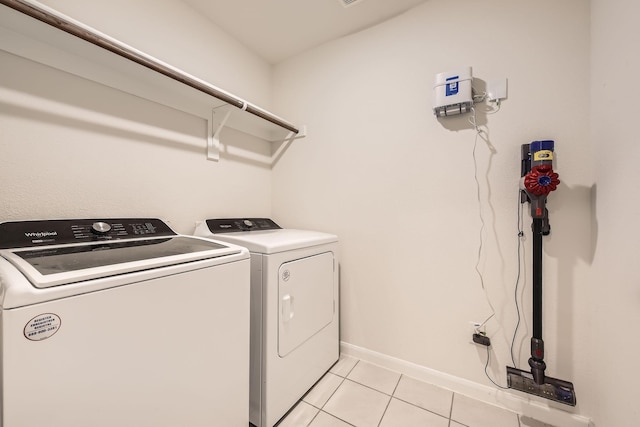 706 Spur Rdg, Princeton, TX 75407 - washroom with washer and dryer, light tile patterned floors, and baseboards