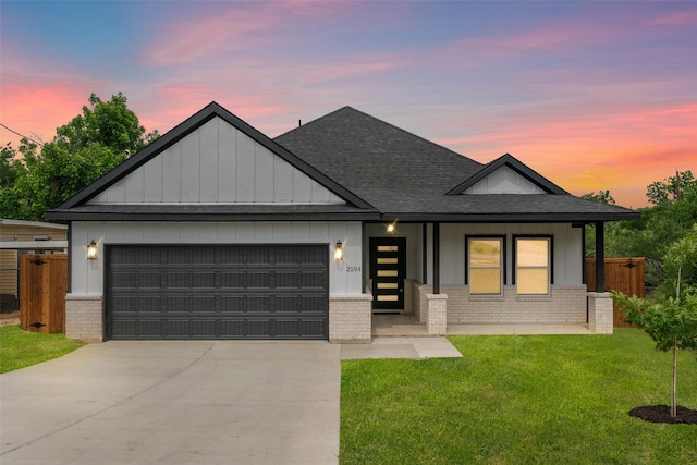 2104 Danner St, Fort Worth, TX 76105 - view of front facade featuring brick siding, roof with shingles, a garage, and driveway