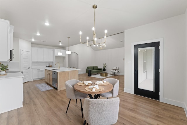2104 Danner St, Fort Worth, TX 76105 - dining space with a chandelier, light wood finished floors, baseboards, and recessed lighting