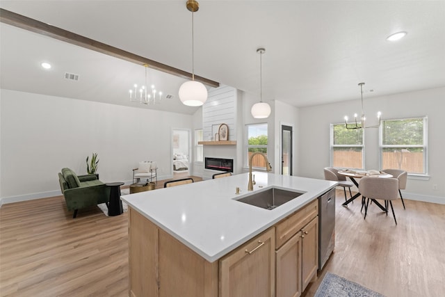 2104 Danner St, Fort Worth, TX 76105 - kitchen with a sink, a chandelier, light wood finished floors, light countertops, and recessed lighting