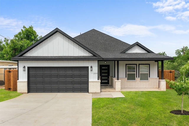 2104 Danner St, Fort Worth, TX 76105 - view of front of home featuring brick siding, roof with shingles, and a garage