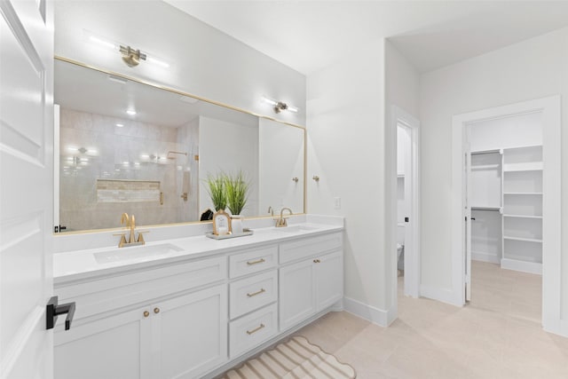 2104 Danner St, Fort Worth, TX 76105 - bathroom featuring tile patterned flooring, double vanity, a tile shower, toilet, and baseboards