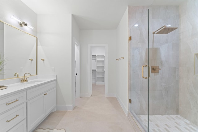 2104 Danner St, Fort Worth, TX 76105 - bathroom with a stall shower, vanity, a spacious closet, and baseboards