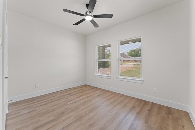 2104 Danner St, Fort Worth, TX 76105 - empty room with light wood-style floors, baseboards, and a ceiling fan