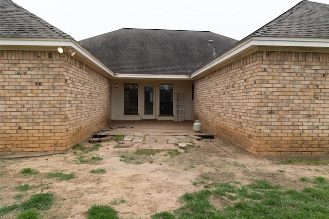 2305 Meadowlark Ln, Bedford, TX 76021 - back of house with roof with shingles and brick siding