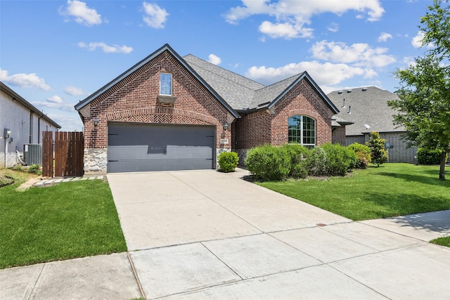 9521 Excursion Dr, Oak Point, TX 75068 - view of front of house with brick siding, central air condition unit, driveway, and stone siding