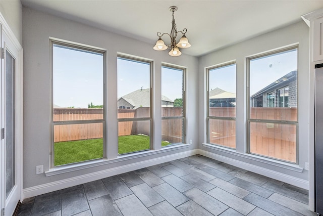 9521 Excursion Dr, Oak Point, TX 75068 - unfurnished sunroom featuring a chandelier, baseboards, and plenty of natural light