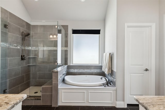 9521 Excursion Dr, Oak Point, TX 75068 - full bathroom with a stall shower, lofted ceiling, and a garden tub