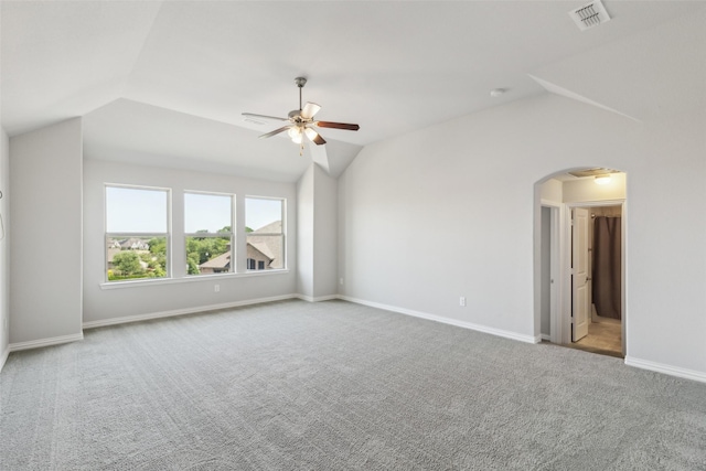 9521 Excursion Dr, Oak Point, TX 75068 - carpeted empty room featuring lofted ceiling, a ceiling fan, arched walkways, and baseboards