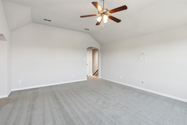9521 Excursion Dr, Oak Point, TX 75068 - unfurnished room with arched walkways, lofted ceiling, a ceiling fan, baseboards, and carpet floors
