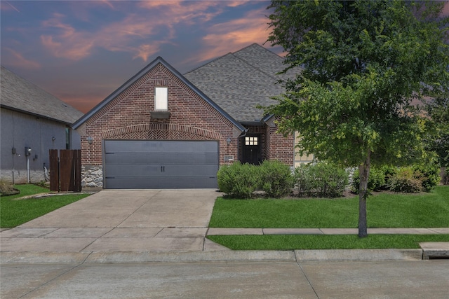 9521 Excursion Dr, Oak Point, TX 75068 - view of front of property featuring brick siding, concrete driveway, a front lawn, roof with shingles, and an attached garage