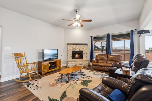 9521 Excursion Dr, Oak Point, TX 75068 - living area featuring a ceiling fan, dark wood finished floors, baseboards, and a stone fireplace