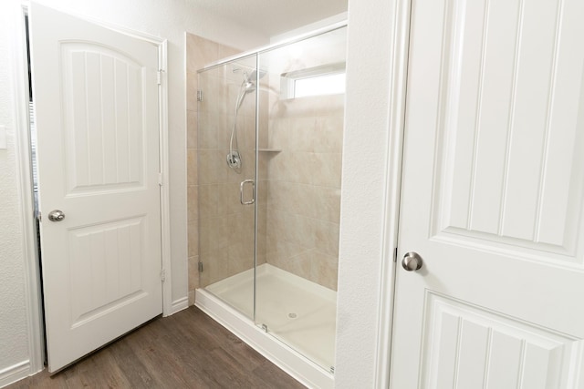 1402 Fantail Ln, Ennis, TX 75119 - full bathroom with a stall shower and wood finished floors