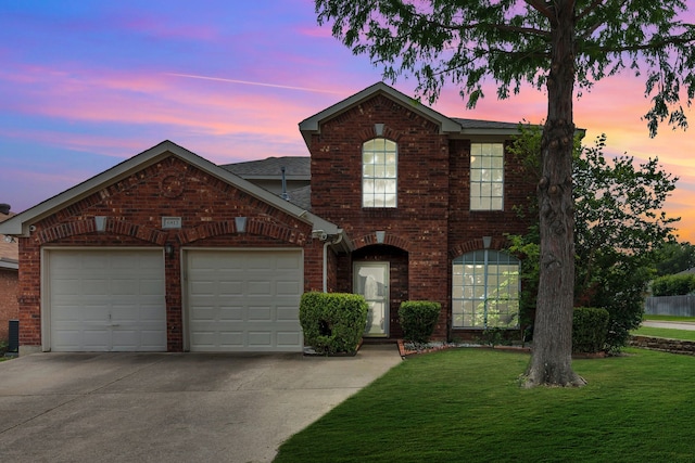 6813 Andress Dr, Fort Worth, TX 76132 - traditional home with brick siding, an attached garage, concrete driveway, and a front yard