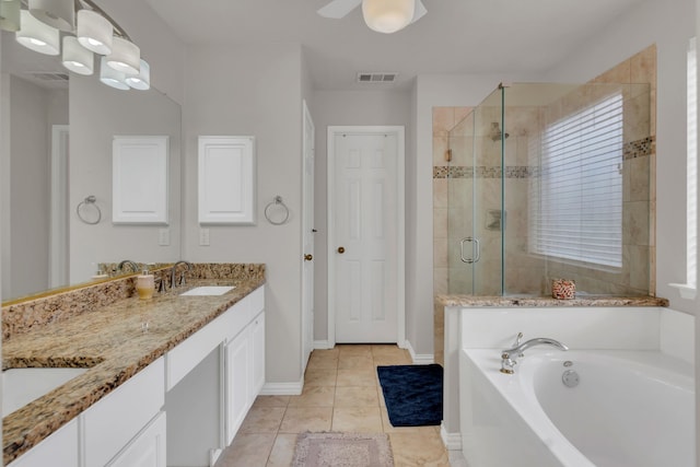 6813 Andress Dr, Fort Worth, TX 76132 - full bathroom featuring a bath, a shower stall, double vanity, tile patterned floors, and baseboards