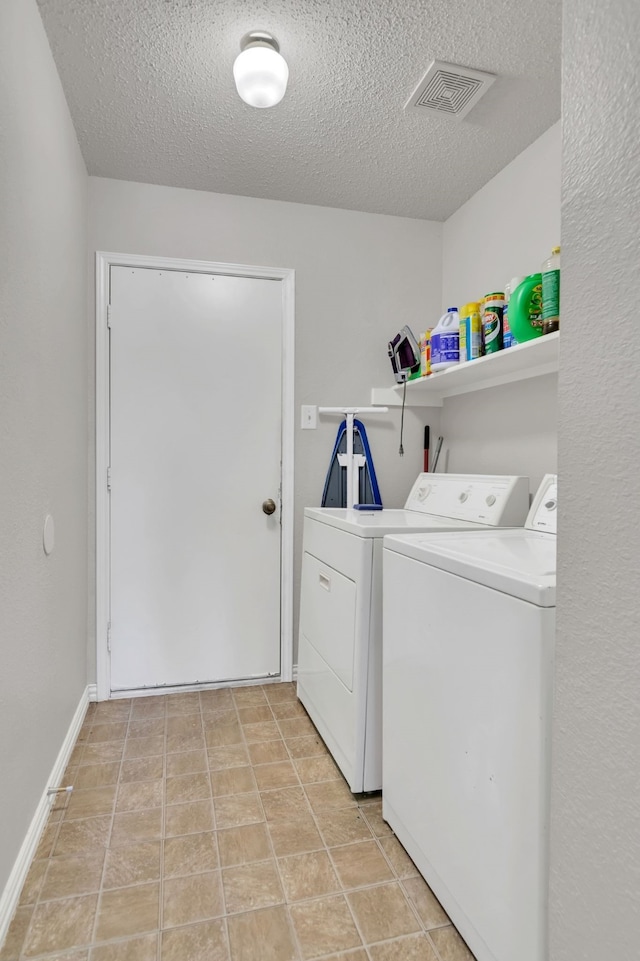 6813 Andress Dr, Fort Worth, TX 76132 - laundry room featuring washer and clothes dryer and a textured ceiling