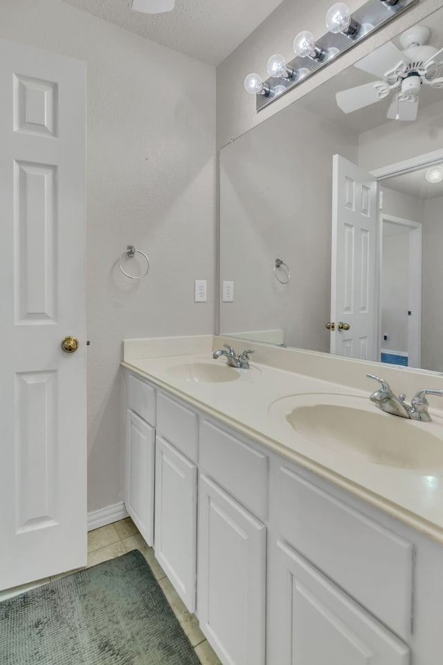 6813 Andress Dr, Fort Worth, TX 76132 - full bath with double vanity, tile patterned flooring, a ceiling fan, and baseboards