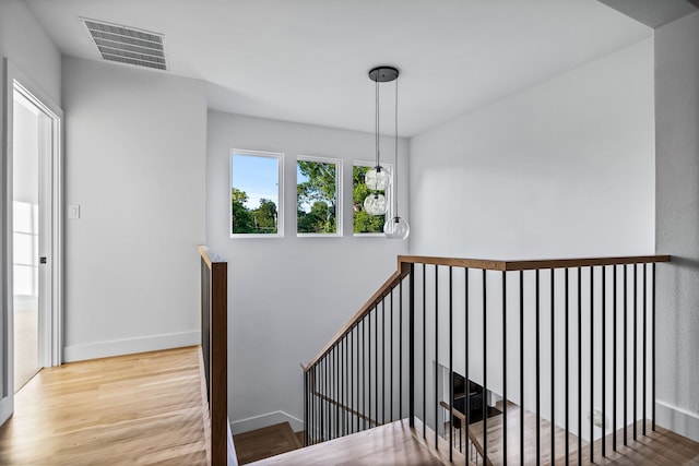 9234 San Fernando Way, Dallas, TX 75218 - stairs with wood finished floors and baseboards