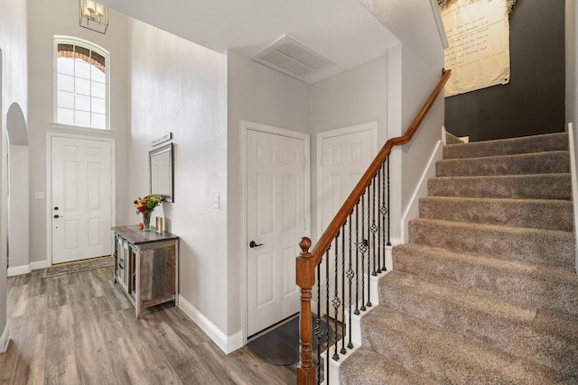 5136 Raisintree Dr, Fort Worth, TX 76244 - entryway with wood finished floors, stairway, arched walkways, and a high ceiling
