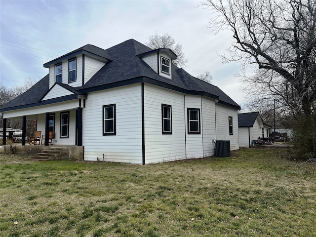 323 E Grand St, Whitewright, TX 75491 - view of side of property featuring central AC, a porch, a lawn, and roof with shingles