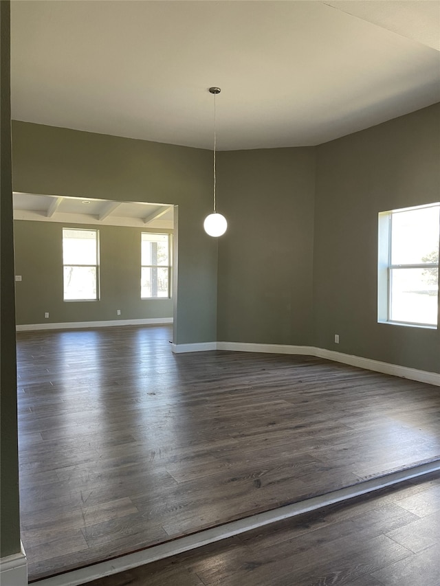 323 E Grand St, Whitewright, TX 75491 - unfurnished room with dark wood-type flooring and baseboards