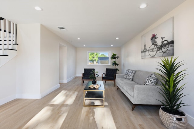 1006 Irene Dr, Mesquite, TX 75149 - living room featuring light wood-style flooring, recessed lighting, baseboards, and stairs
