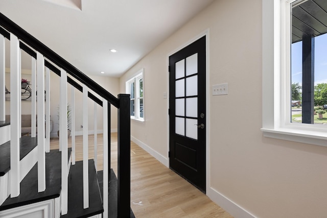 1006 Irene Dr, Mesquite, TX 75149 - entrance foyer featuring light wood-style flooring, stairway, baseboards, and recessed lighting