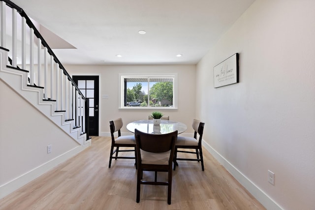 1006 Irene Dr, Mesquite, TX 75149 - dining space featuring baseboards, light wood-type flooring, stairs, and recessed lighting