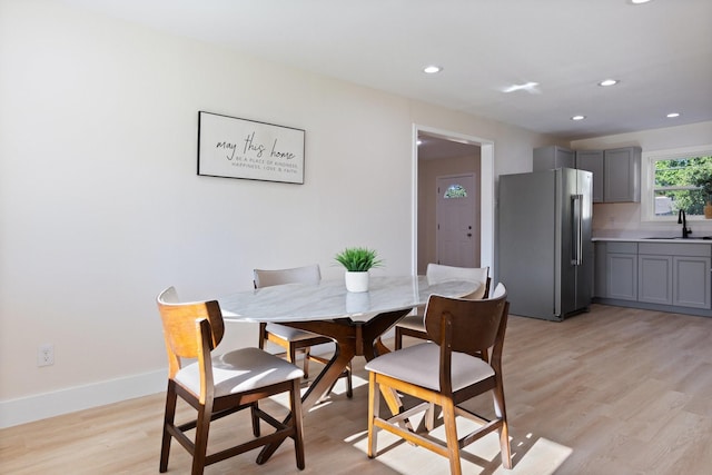 1006 Irene Dr, Mesquite, TX 75149 - dining room with recessed lighting, light wood-style flooring, and baseboards