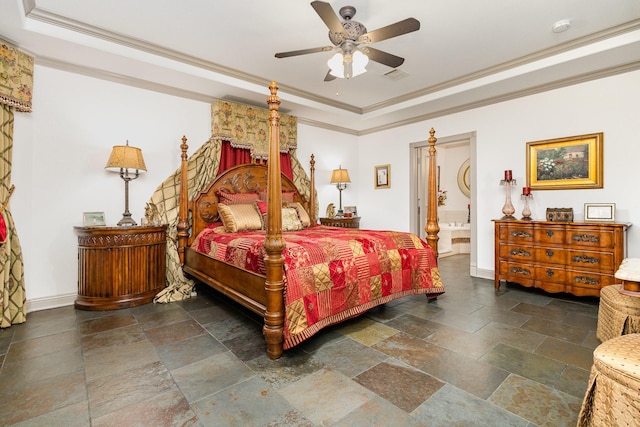 2605 Cherry Sage Dr, Flower Mound, TX 75022 - bedroom featuring a tray ceiling, stone tile flooring, crown molding, baseboards, and connected bathroom