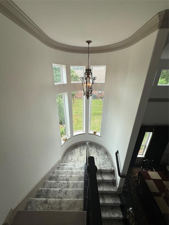 2605 Cherry Sage Dr, Flower Mound, TX 75022 - staircase featuring a chandelier and crown molding