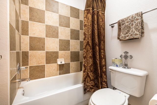 2605 Cherry Sage Dr, Flower Mound, TX 75022 - bathroom featuring toilet, shower / bath combination with curtain, and a textured wall