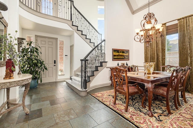 2605 Cherry Sage Dr, Flower Mound, TX 75022 - dining space with a towering ceiling, a chandelier, stairway, and baseboards