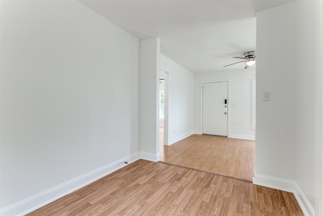 3109 S Wesleyan Dr, Fort Worth, TX 76105 - empty room with light wood-style flooring, a ceiling fan, and baseboards