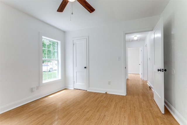 3109 S Wesleyan Dr, Fort Worth, TX 76105 - unfurnished bedroom with light wood finished floors, baseboards, and ceiling fan