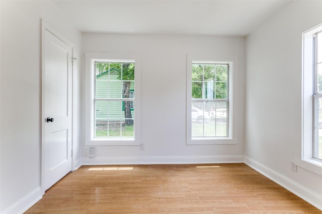 3109 S Wesleyan Dr, Fort Worth, TX 76105 - spare room with healthy amount of natural light, light wood-type flooring, and baseboards