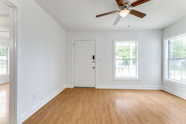 3109 S Wesleyan Dr, Fort Worth, TX 76105 - foyer entrance featuring light wood-style flooring, baseboards, and ceiling fan