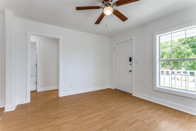3109 S Wesleyan Dr, Fort Worth, TX 76105 - spare room featuring light wood-type flooring, baseboards, and a ceiling fan
