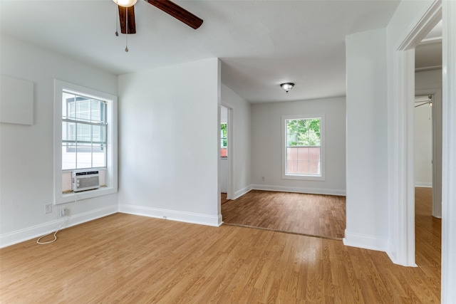 3109 S Wesleyan Dr, Fort Worth, TX 76105 - empty room featuring ceiling fan, light wood-style floors, baseboards, and cooling unit