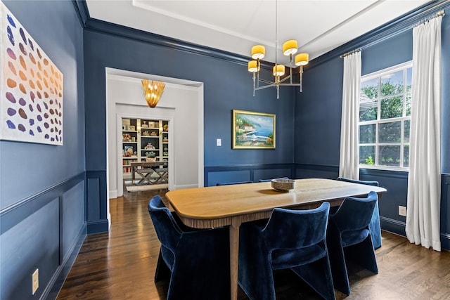 2237 Gatsby Way, Carrollton, TX 75010 - dining room featuring a chandelier, dark wood finished floors, crown molding, a decorative wall, and wainscoting