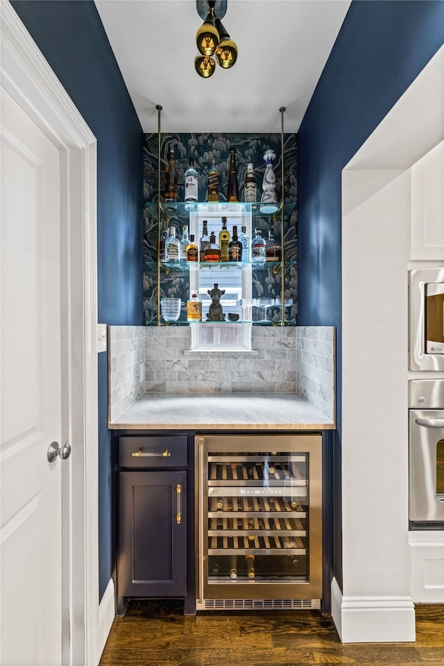 2237 Gatsby Way, Carrollton, TX 75010 - indoor dry bar featuring appliances with stainless steel finishes, beverage cooler, tasteful backsplash, and dark wood-style floors