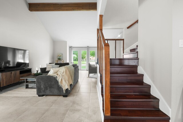 living area featuring high vaulted ceiling, stairs, beamed ceiling, and light tile patterned floors