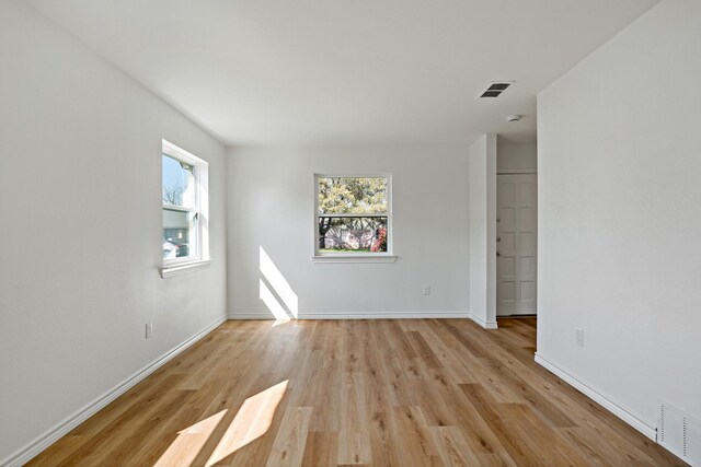 12816/12818 Pandora Dr, Dallas, TX 75238 - empty room with light wood-type flooring and baseboards
