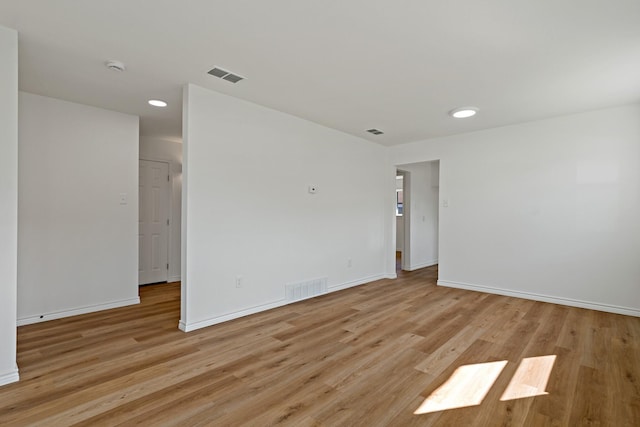 12816/12818 Pandora Dr, Dallas, TX 75238 - spare room featuring baseboards, light wood-type flooring, recessed lighting, and a smoke detector