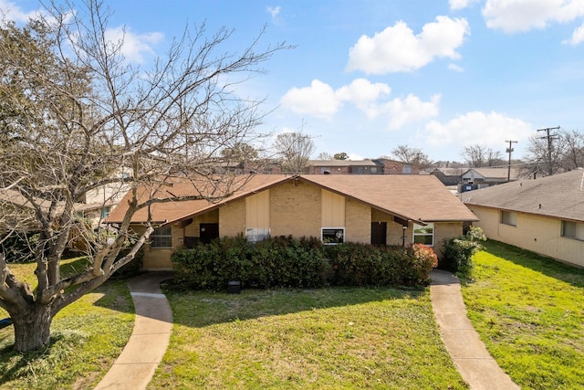 12816/12818 Pandora Dr, Dallas, TX 75238 - mid-century home with brick siding, a front lawn, and roof with shingles