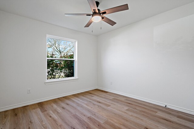 12816/12818 Pandora Dr, Dallas, TX 75238 - unfurnished room featuring wood finished floors, baseboards, and a ceiling fan